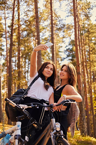 Two girls doing selfie after bicycle ride.