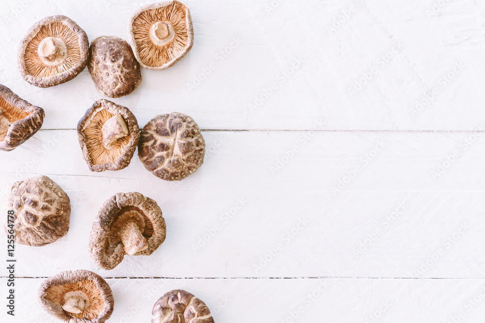 Raw natural mushrooms on wooden background Raw natural mushrooms on wooden background