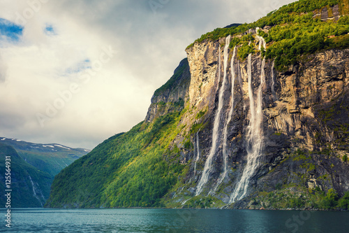 Geiranger fjord. Seven Sisters Waterfall, Norway. Mountain landscape with cloudy sky. Beautiful nature.  photo