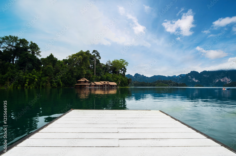 Holiday vacation, white wooden board on lake