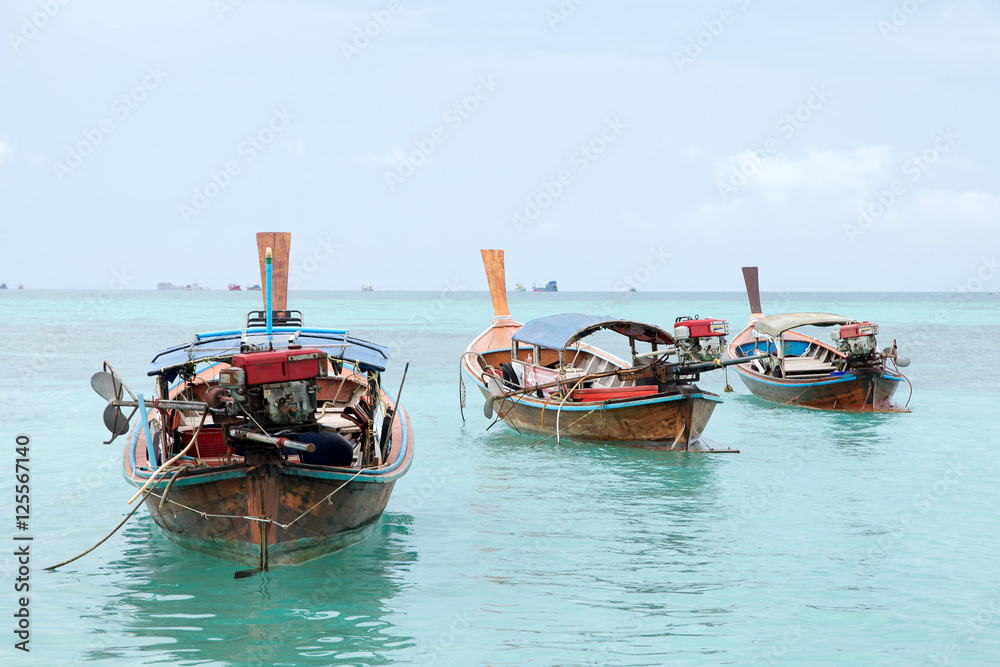 Long Tail Boats at Phi Phi Leh island, Thailand Long Tail Boats at Phi Phi Leh island, Thailand