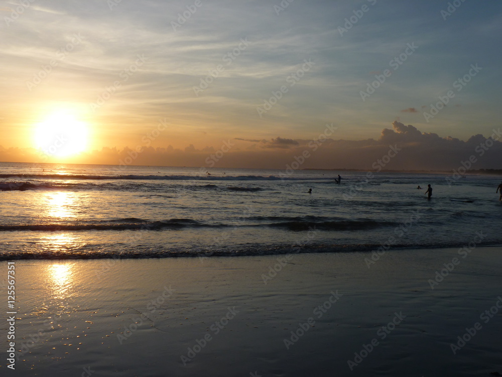 Beautiful sunset on the tropical sandy beach in Bali. Indonesia