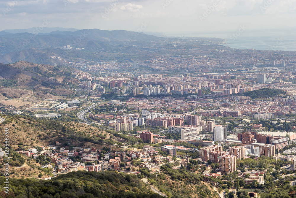 Sunny View of Barcelona city from the Mount Tibidabo, Catalonia,