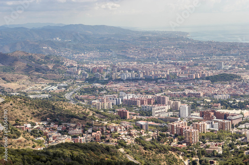 Sunny View of Barcelona city from the Mount Tibidabo, Catalonia,