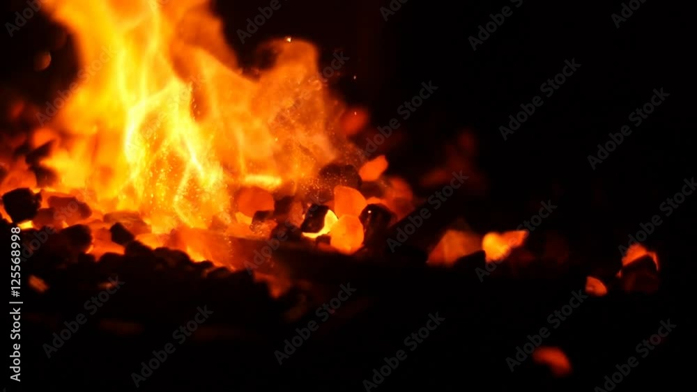 Burning Flames and Coals in a Forge Burning Flames and Coals in a Forge