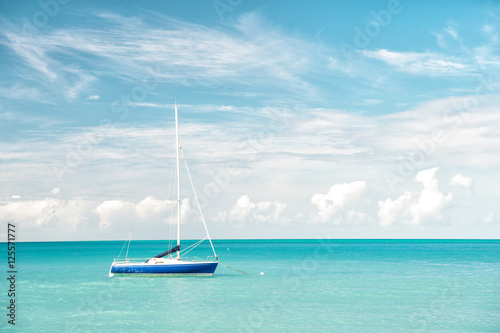 Attractive bright view of exotic colorful beautiful marine beach with boat on blue water © be free