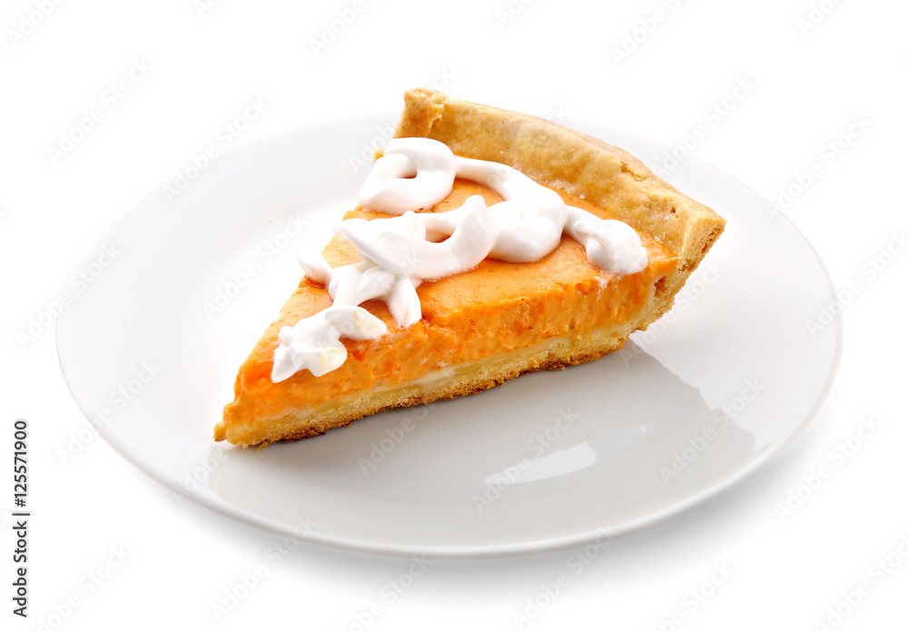 Plate with delicious pumpkin cake on white background