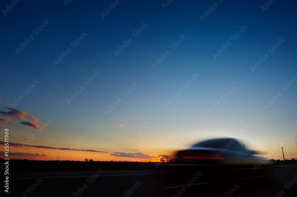 Obraz premium Car silhouette on sunset background