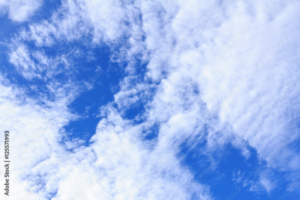 Obraz premium Blue sky background with white clouds. The vast blue sky and clouds sky on sunny day. White fluffy clouds in the blue sky.