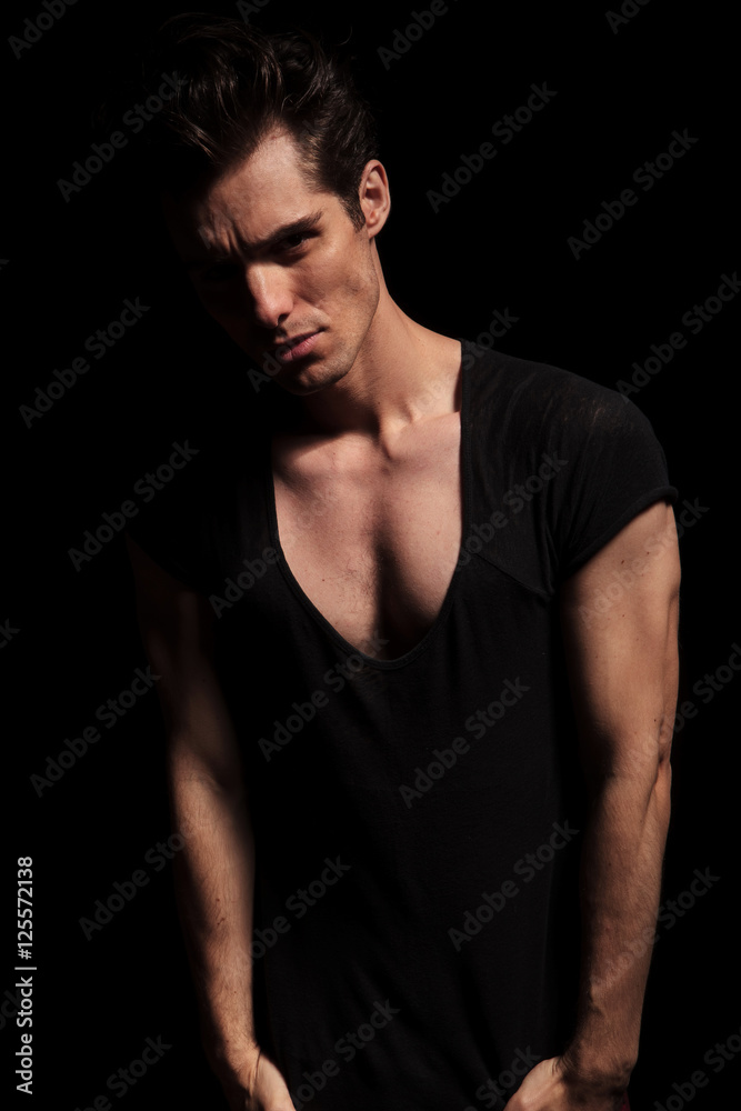 dramatic young man with hands in pockets dramatic young man with hands in pockets