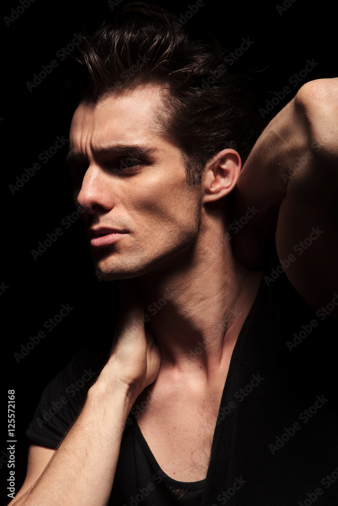 side closeup picture of a sexy fashion man posing side closeup picture of a sexy fashion man posing