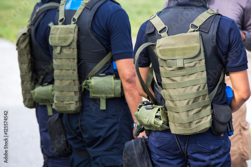 law enforcement with tactical equipment team in field training c