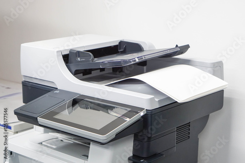 close up paper sheets on the printer in office photo