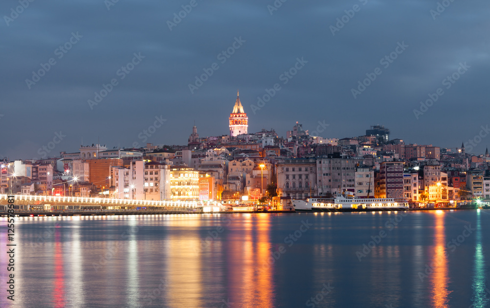 Nighte cityscape with Galata Tower over the Golden Horn in Istanbul, Turkey