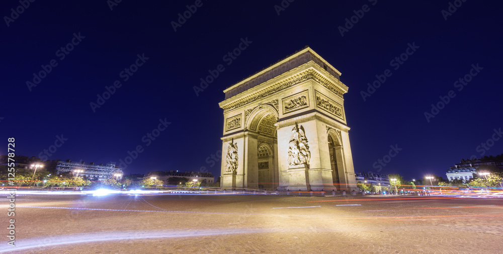 Arc de Triomphe and blurred traffic at night