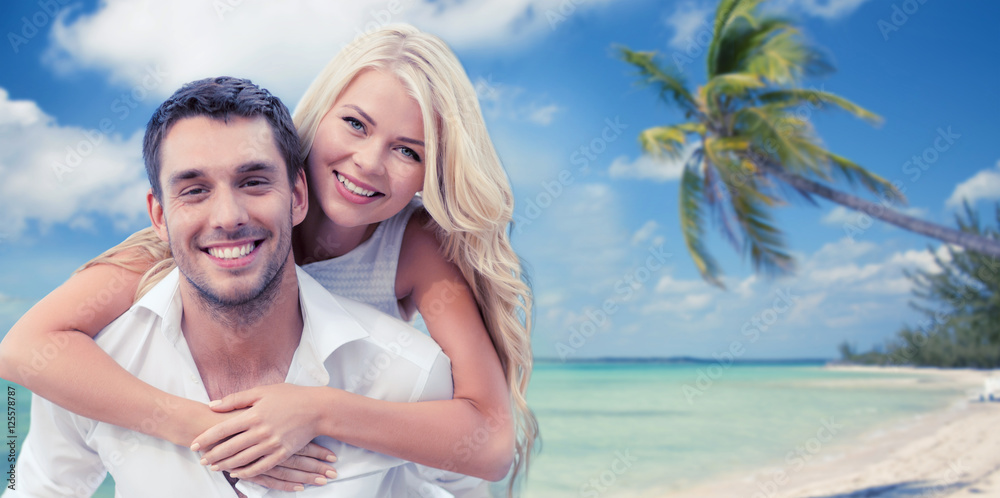 happy couple having fun over beach background happy couple having fun over beach background