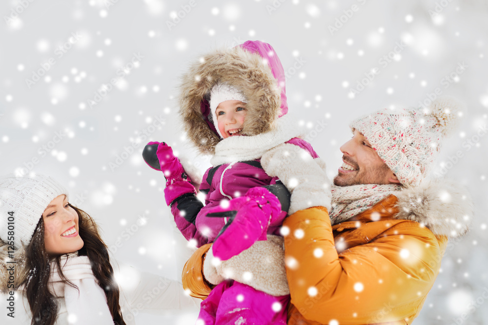 happy family with child in winter clothes outdoors happy family with child in winter clothes outdoors