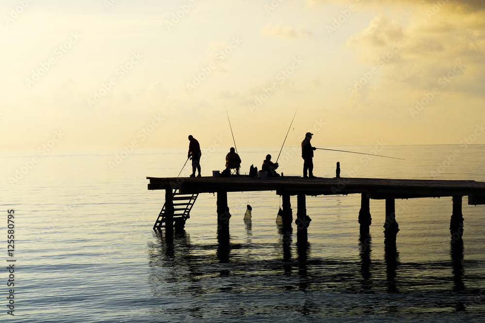 Fototapeta premium Local fishermen catch fish from the pier.