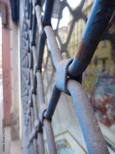 old closed metal curtain of a shop