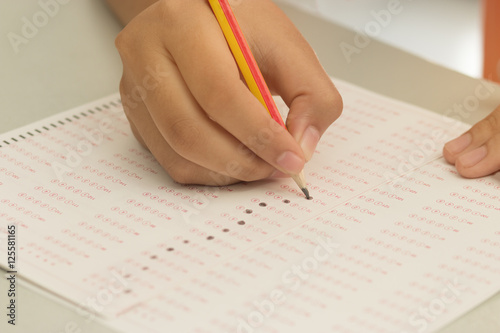 Thai student testing in exercise, exams answer sheets with penci photo