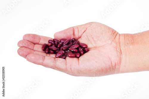 lady hold kidney beans in hand on white background