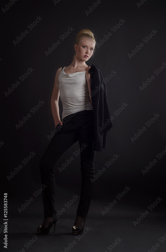 Beautiful blonde woman in a severe business suit Beautiful blonde woman in a severe business suit