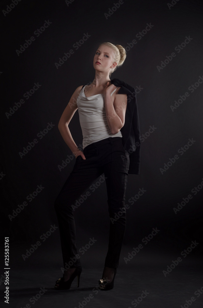 Beautiful blonde woman in a severe  business suit