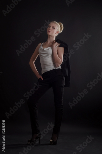 Beautiful blonde woman in a severe  business suit © Alona Dudaieva