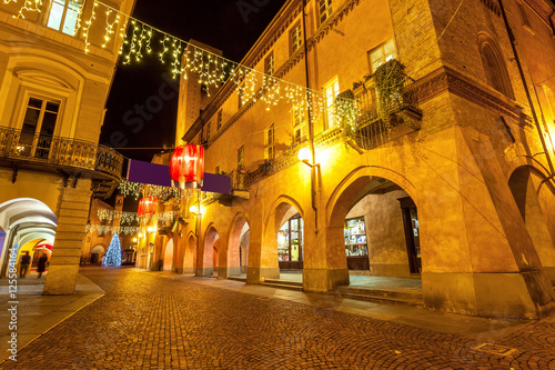 Decorated evening street in Alba  Italy.