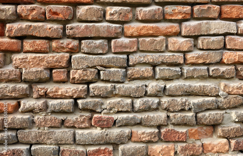 Red old brick wall structure background.