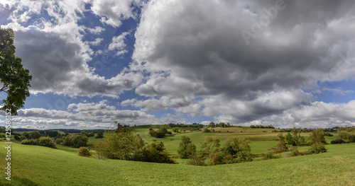 thick clouds on green fall  countryside  Germany