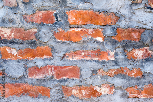 Red brick wall with cement