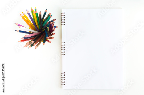 Sketchbook mock-up for artwork with watercolor  pastels in yellow glass. Top view.