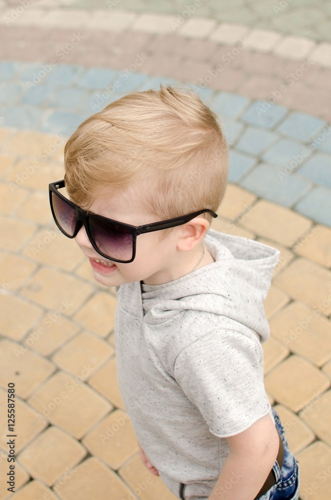 Small baby boy is faving fun in the park Small baby boy is faving fun in the park