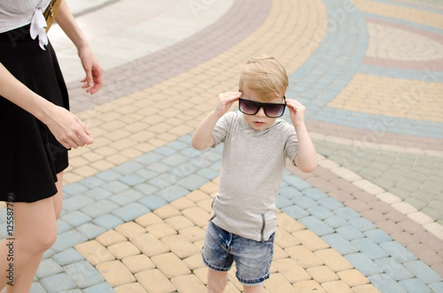 Small baby boy is faving fun in the park photo