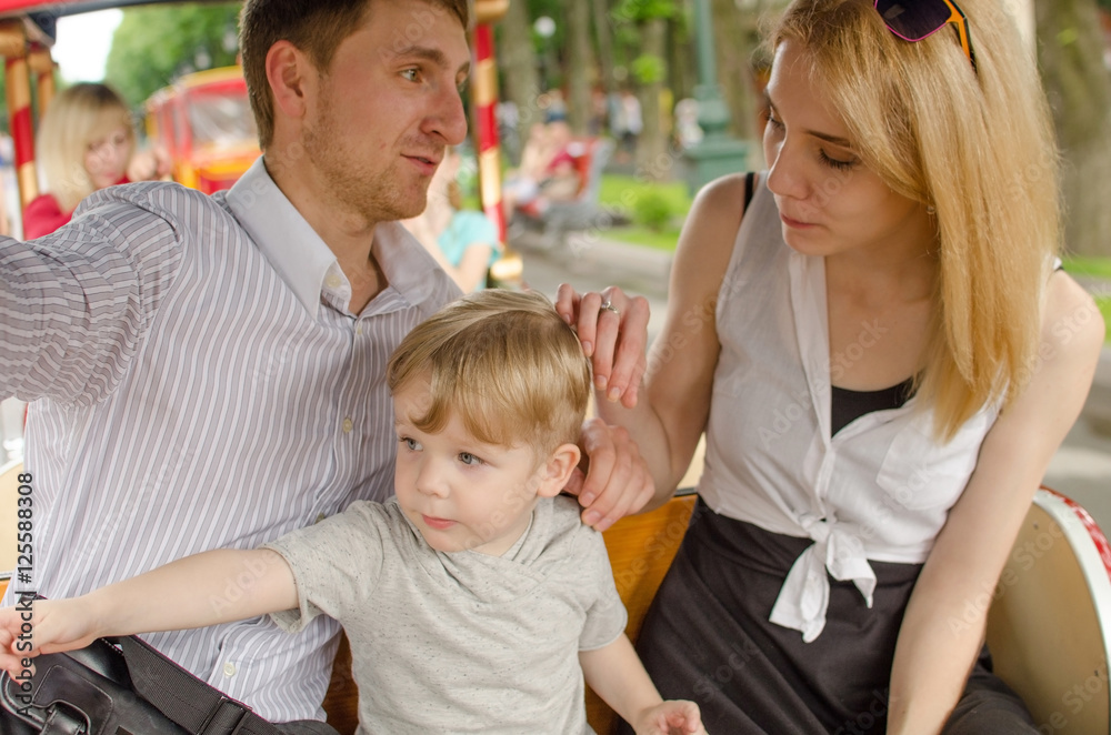 Young family is having fun in the park Young family is having fun in the park