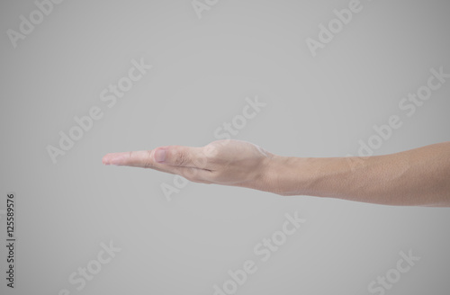 close-up man hand arm sign isolated on gray background