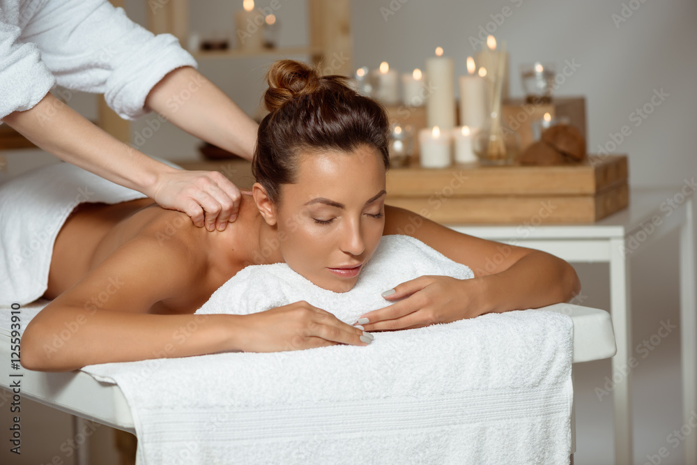 Young attractive girl having massage relaxing in spa salon. Young attractive girl having massage relaxing in spa salon.