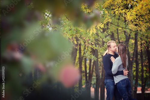 Happy couple kissing outdoors