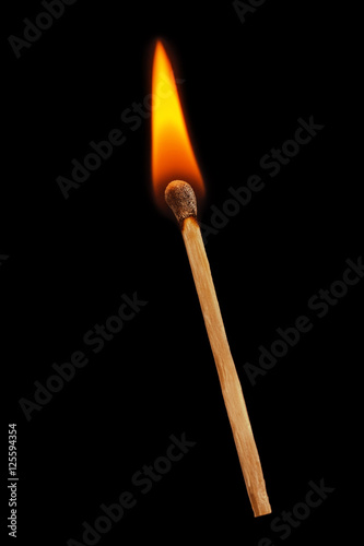 Matchstick on a black background. Soft focus view.