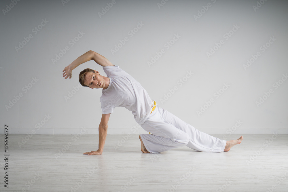 Naklejka premium Man practicing Capoeira , brazilian martial Art.