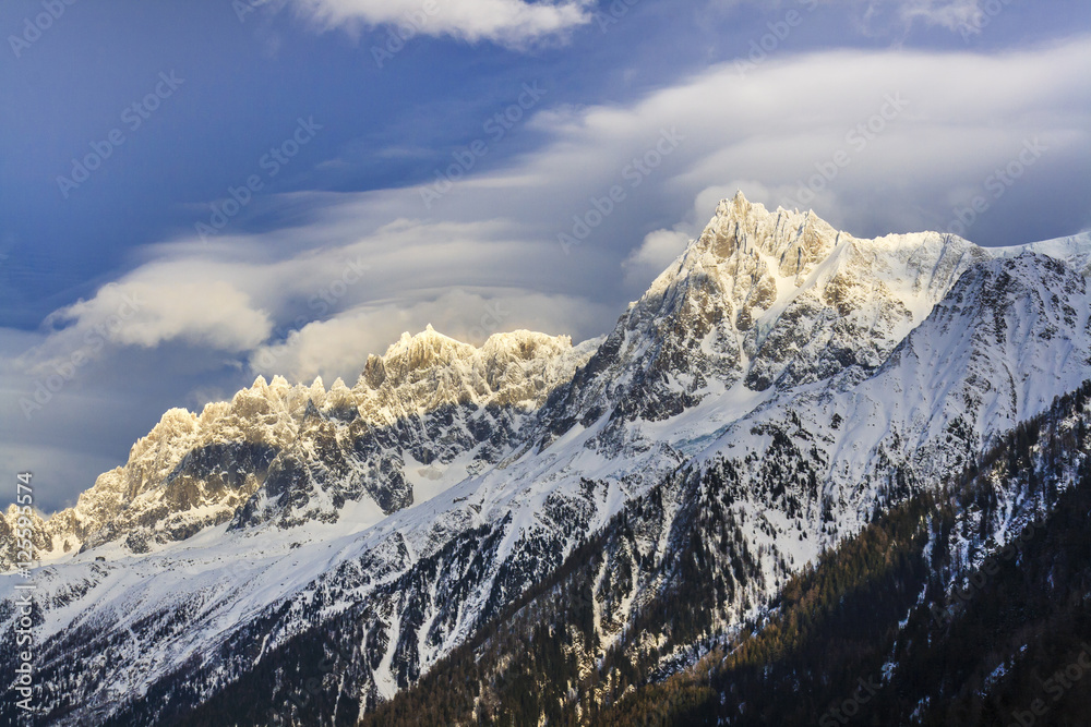 Winter mountain landscape at sunset in Alps.