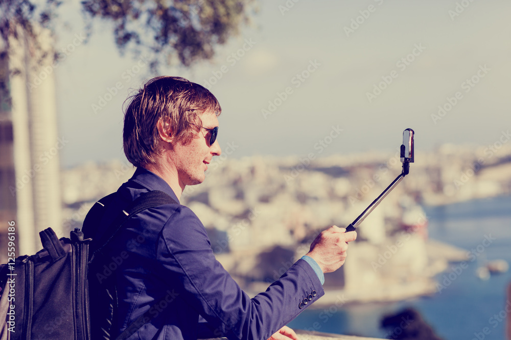 young tourist taking a selfie photo while travel in Europe young tourist taking a selfie photo while travel in Europe
