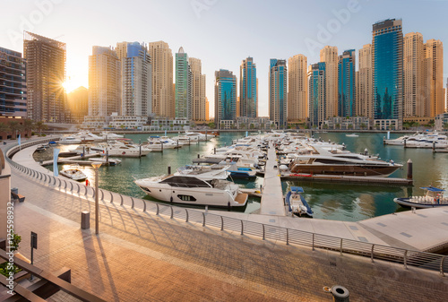 Dubai Marina Sunset in a sunny day with a Beautiful view of dubai marina towers and walk