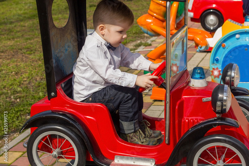 Little boy is riding the car