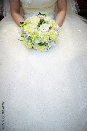 Bride holding wedding bouquet 