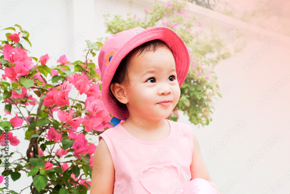Asian little girl on pink hat and dress Asian little girl on pink hat and dress