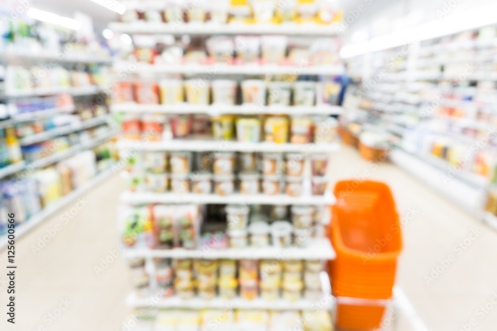 Modern supermarket blurred on background
