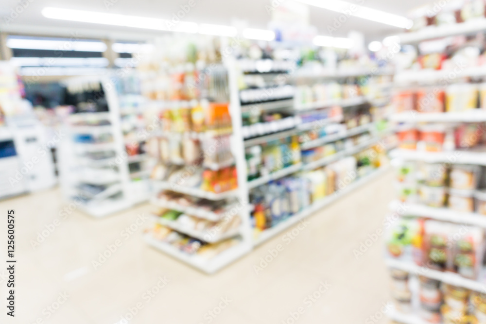 Modern supermarket blurred on background