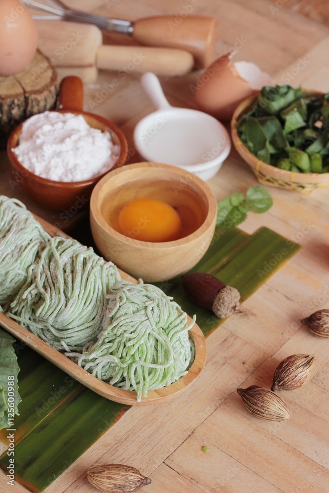 Making jade noodle made of vegetable and egg. Making jade noodle made of vegetable and egg.